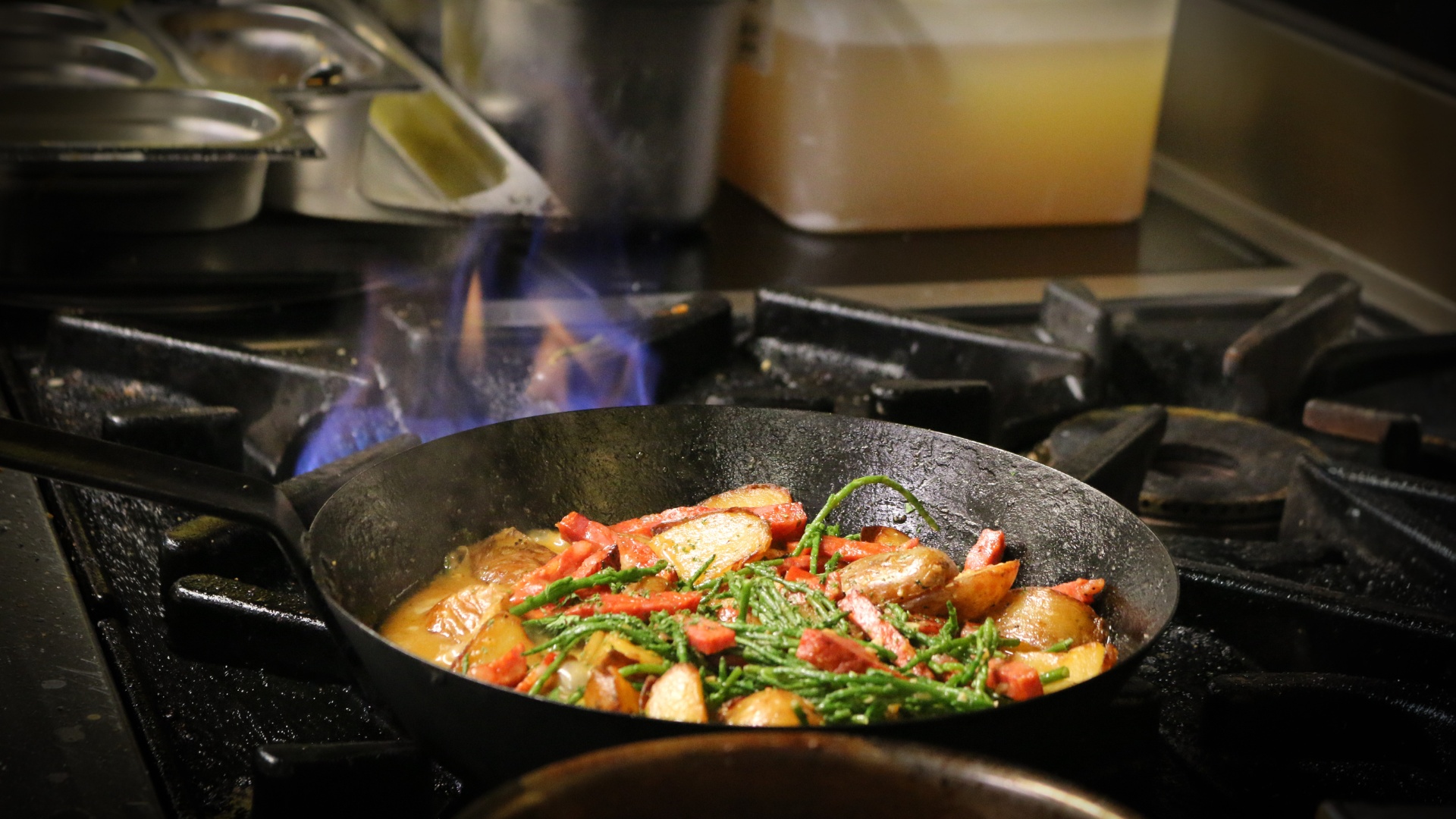 Chef cooking with flames