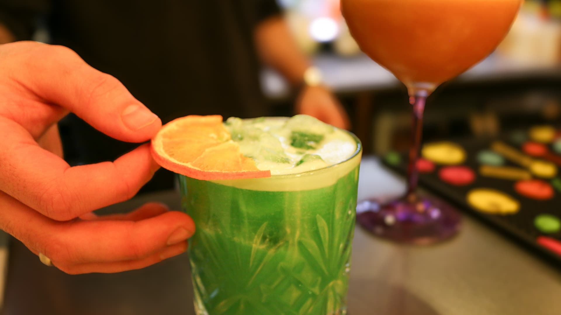 A cocktail being garnished at the bar