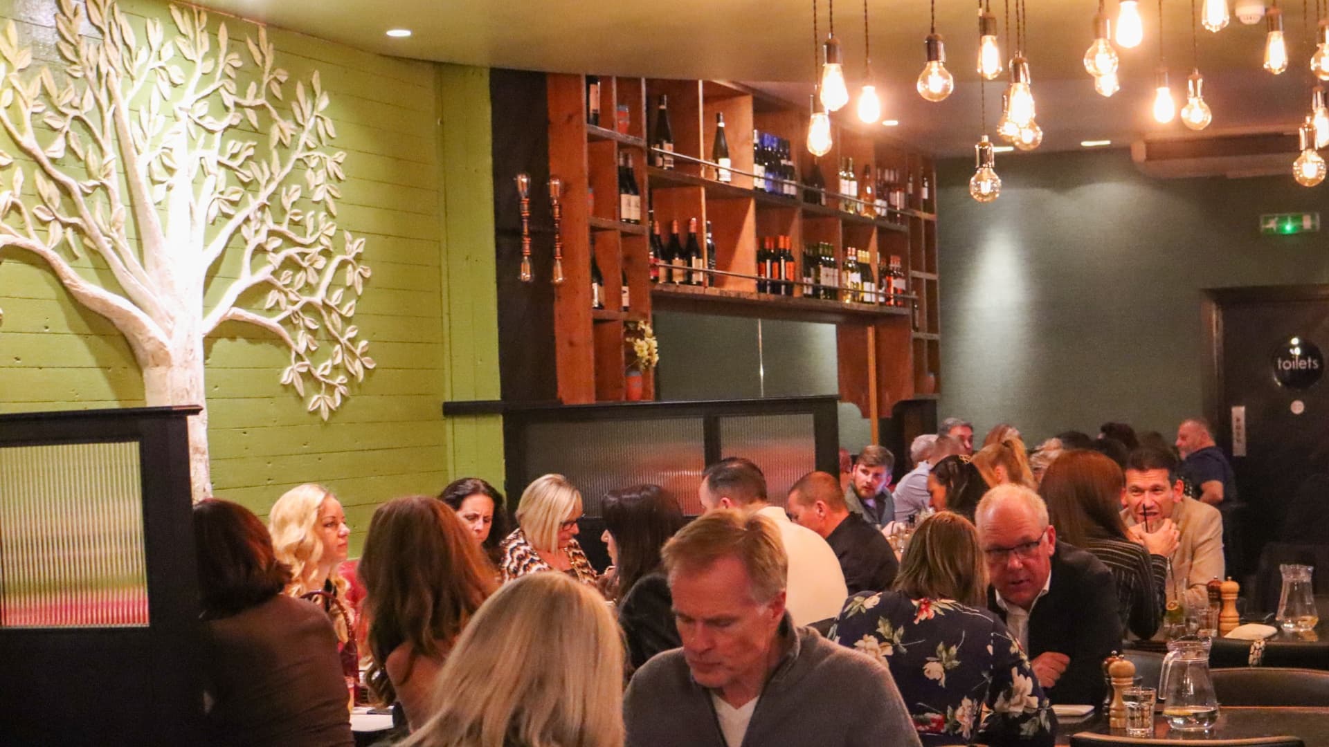 A full dining room on a busy evening