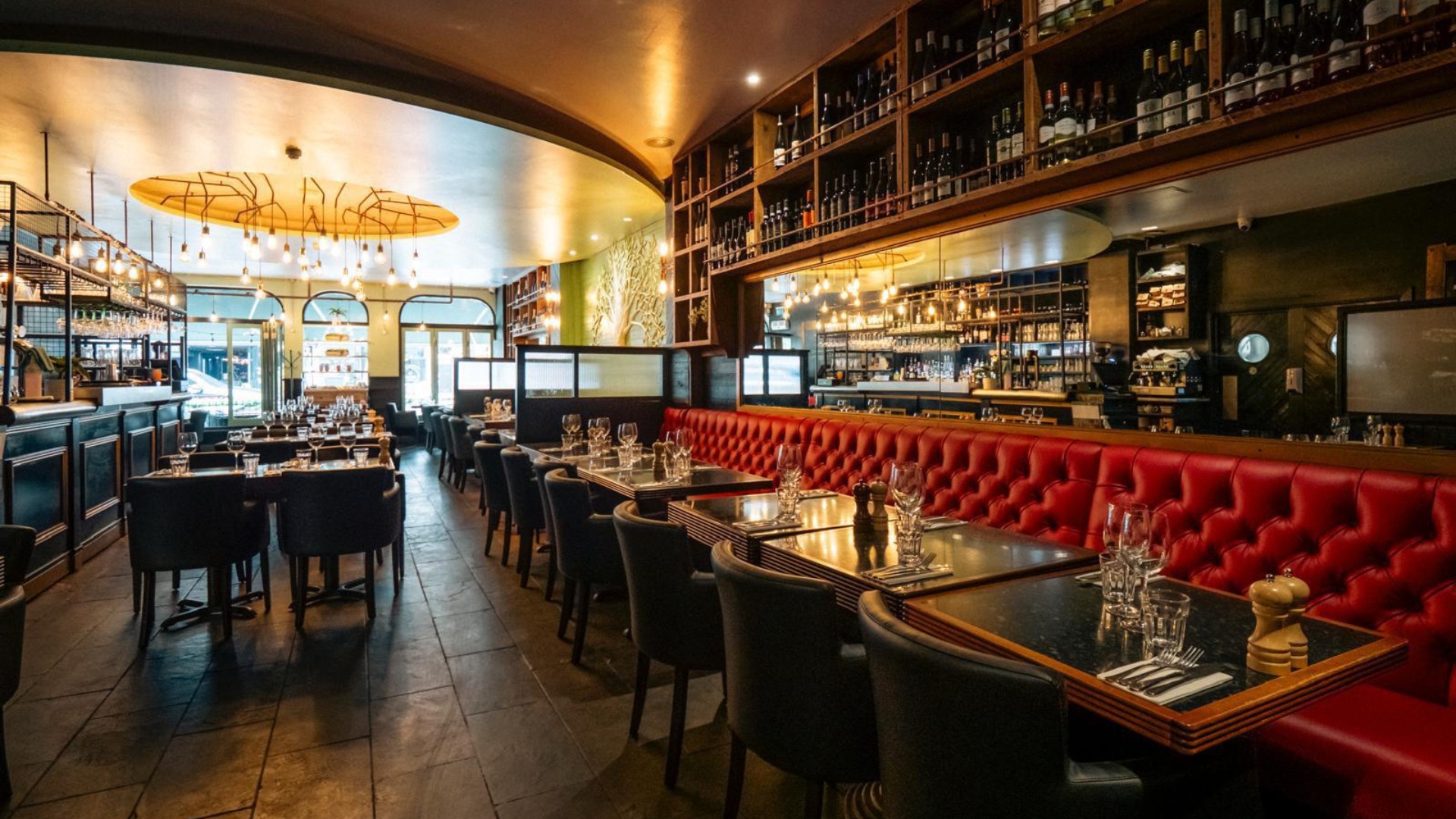 Elegant restaurant interior with red leather booths