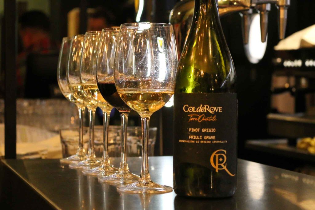 Friends enjoying wine pairings at The Olive Tree